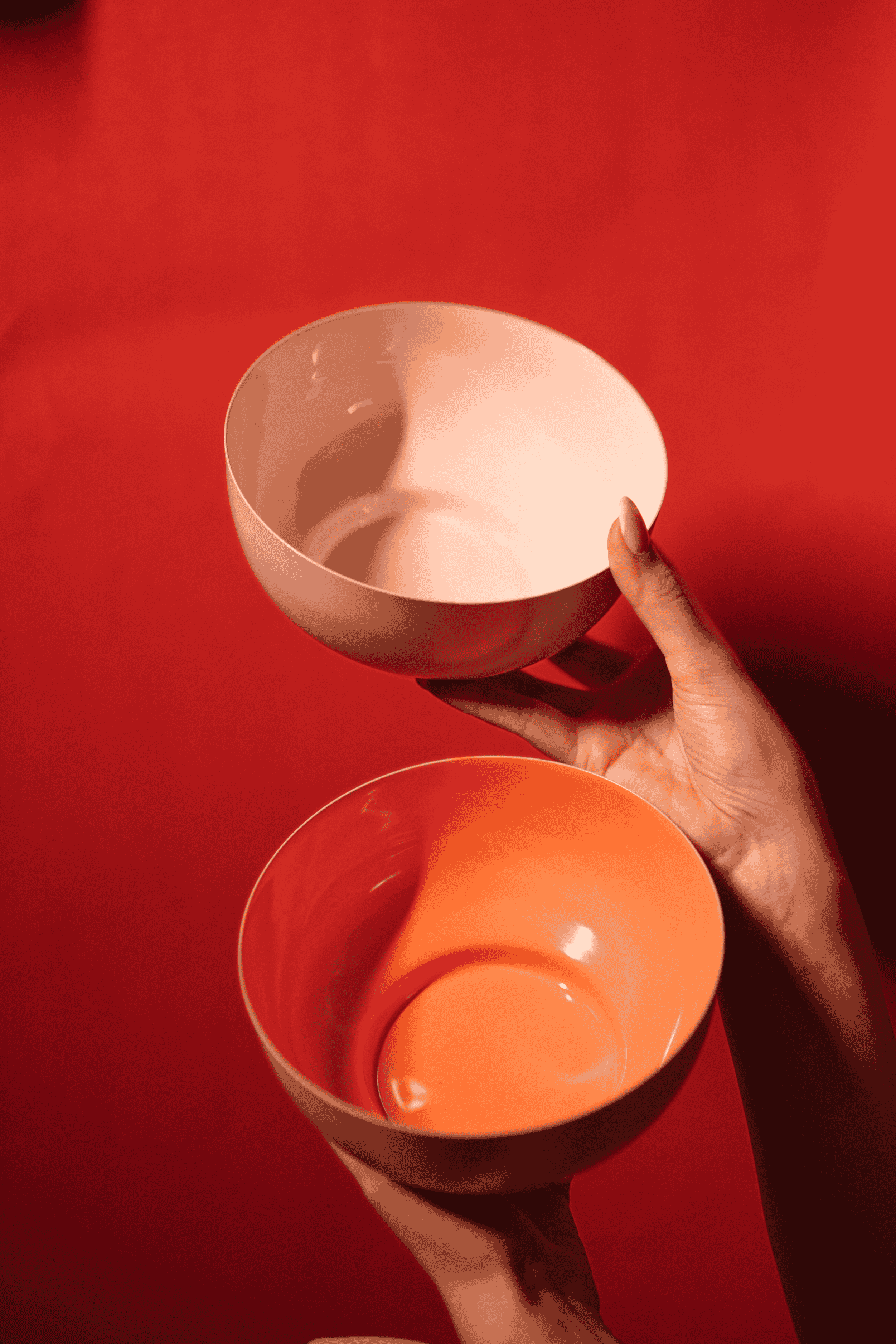 Bon Bon metal fruit bowl in orange and pink with enamel finish