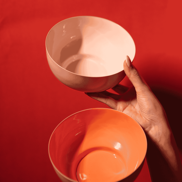 Bon Bon metal fruit bowl in orange and pink with enamel finish