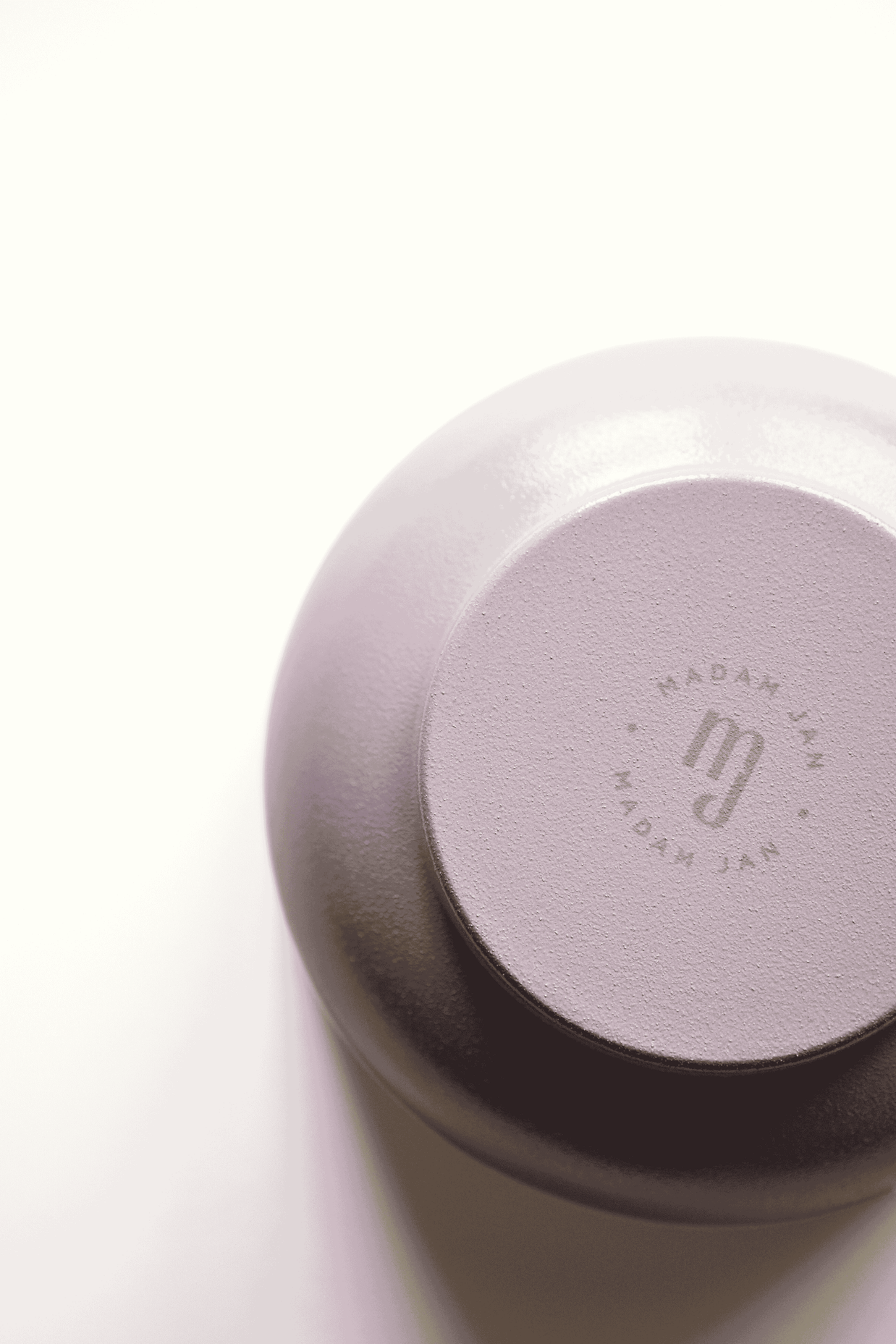 Lavender metal bowl with 'MADAM JAN' branding on a white background