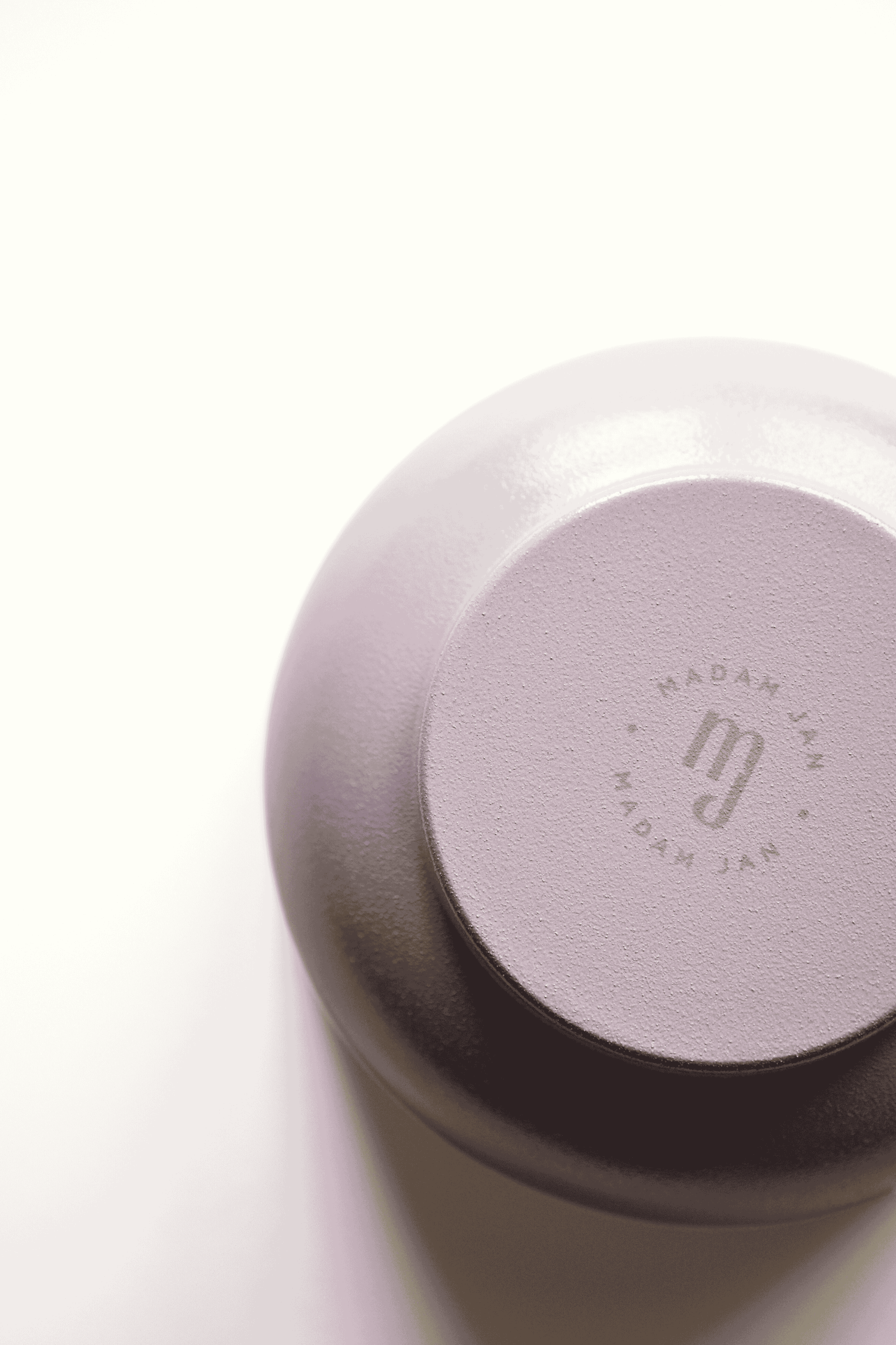 Lavender metal bowl with 'MADAM JAN' branding on a white background