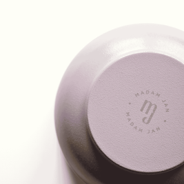 Lavender metal bowl with 'MADAM JAN' branding on a white background