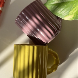 Sculptural fluted ceramic mug with glossy surface