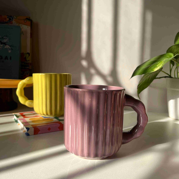 Handcrafted ceramic mug with fluted texture