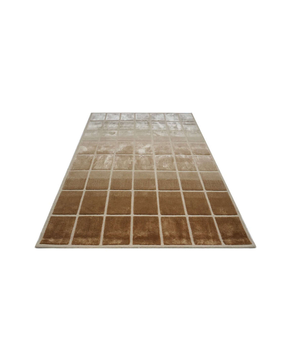 F A D E luxury modern rug by Cherom, showcasing a soft ombré effect in warm brown and beige tones.