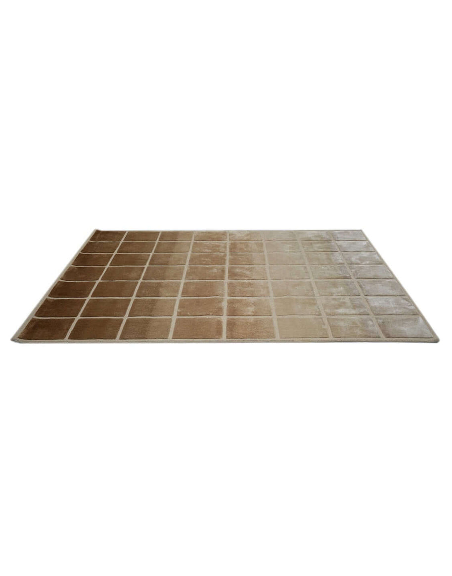 F A D E luxury modern rug by Cherom, showcasing a soft ombré effect in beige and brown tiles, perfect for contemporary spaces.
