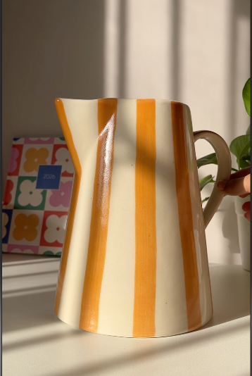Gelato ceramic vase can be used for holding fresh flowers in a home setting.