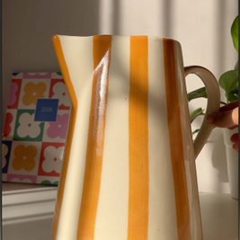 Gelato ceramic vase can be used for holding fresh flowers in a home setting.