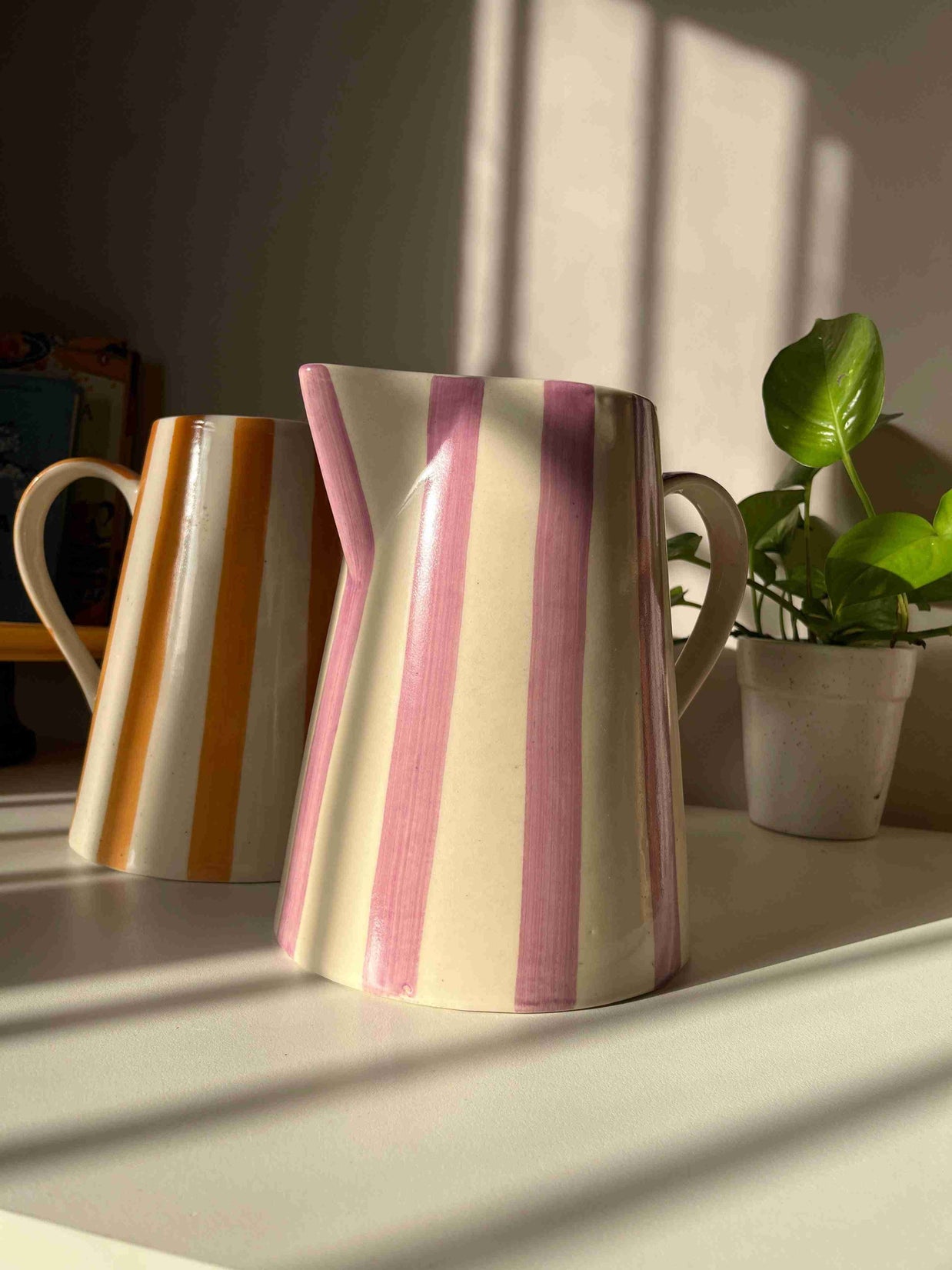 Striped ceramic jug vase from the Gelato Collection displayed as home decor.