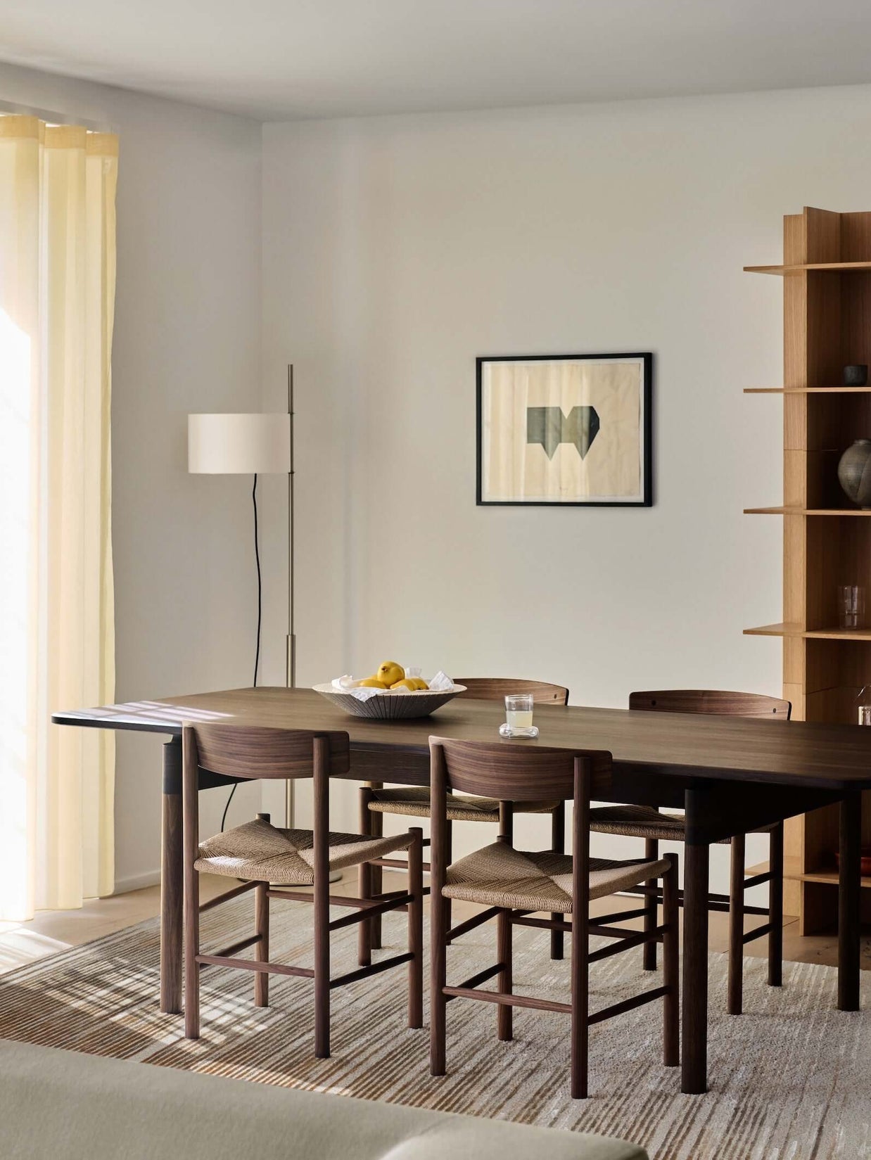 H O R I Z O N luxury modern rug by Cherom in a contemporary dining space with stylish furniture.