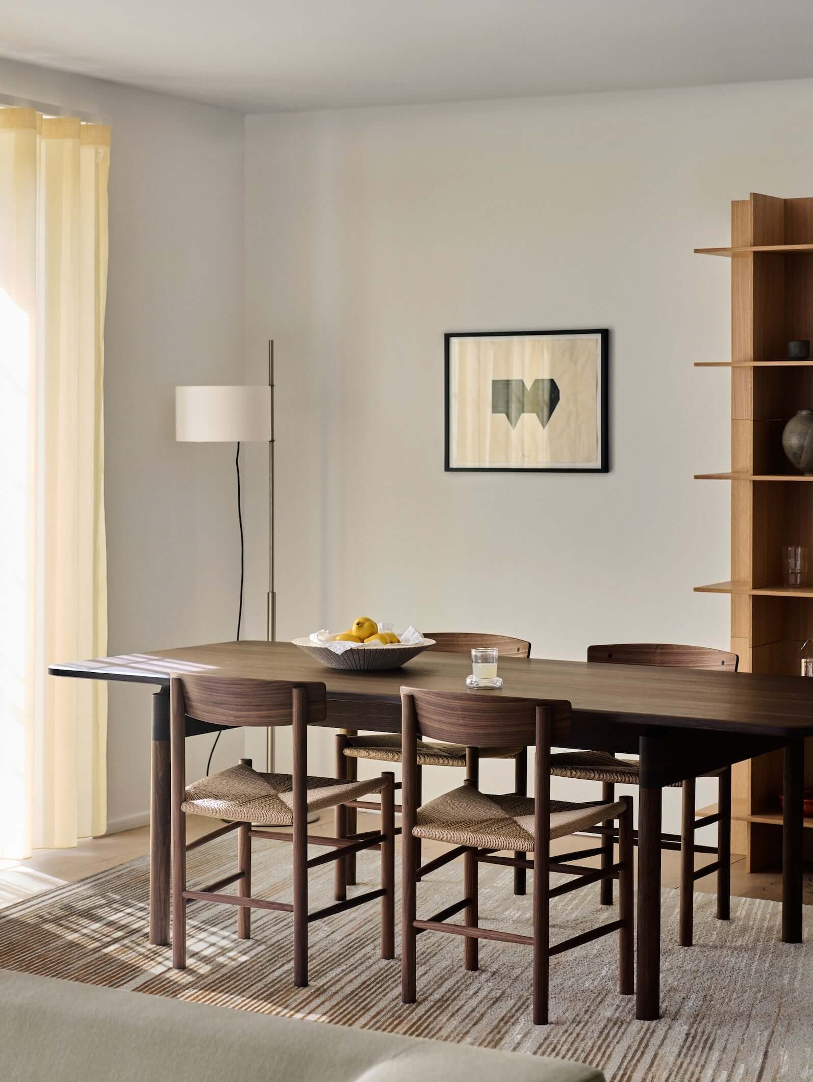 H O R I Z O N luxury modern rug by Cherom in a contemporary dining space with stylish furniture.