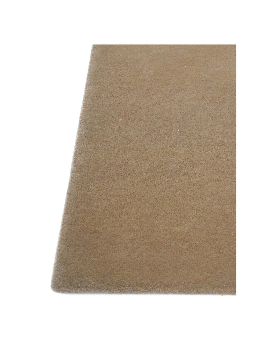 I C O N - L A T T E rug in soft beige showcasing high density tufting and premium New Zealand wool craftsmanship.