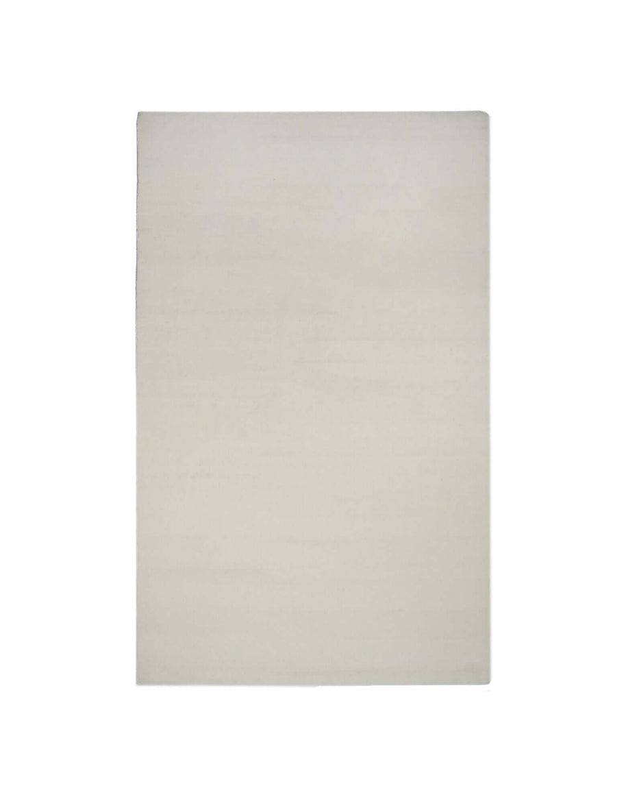 I C O N - M I L K hand-tufted rug in soft cream color, crafted from 100% New Zealand wool, featuring durable high density tufting.