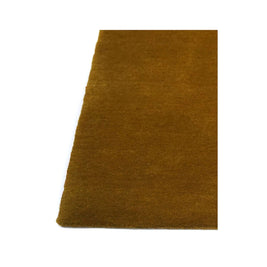 I C O N - O C H R E rug detail showing high-quality New Zealand wool and rich ochre color.