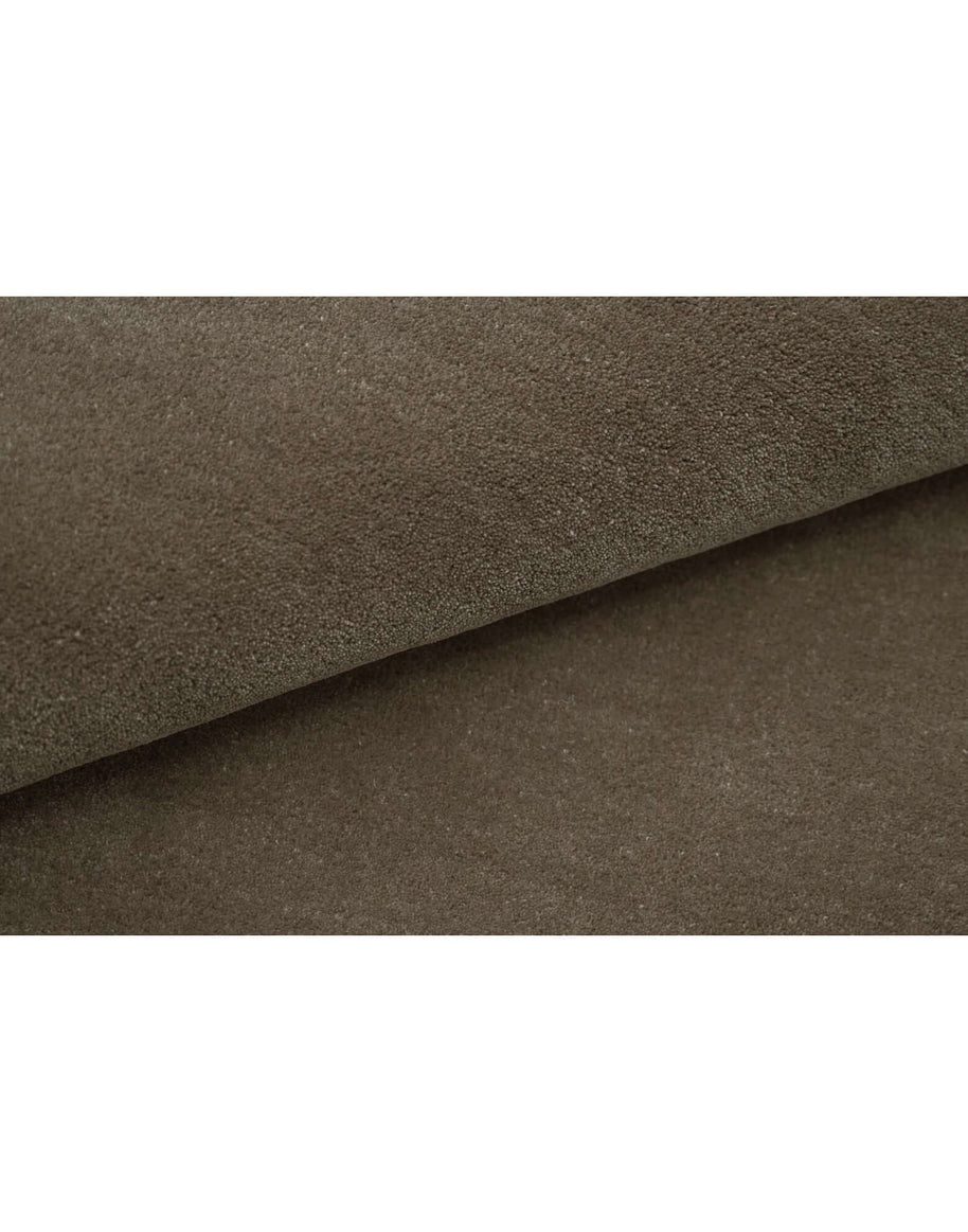 Texture detail of I C O N - T R U F F L E rug showcasing the premium New Zealand wool in rich brown color.
