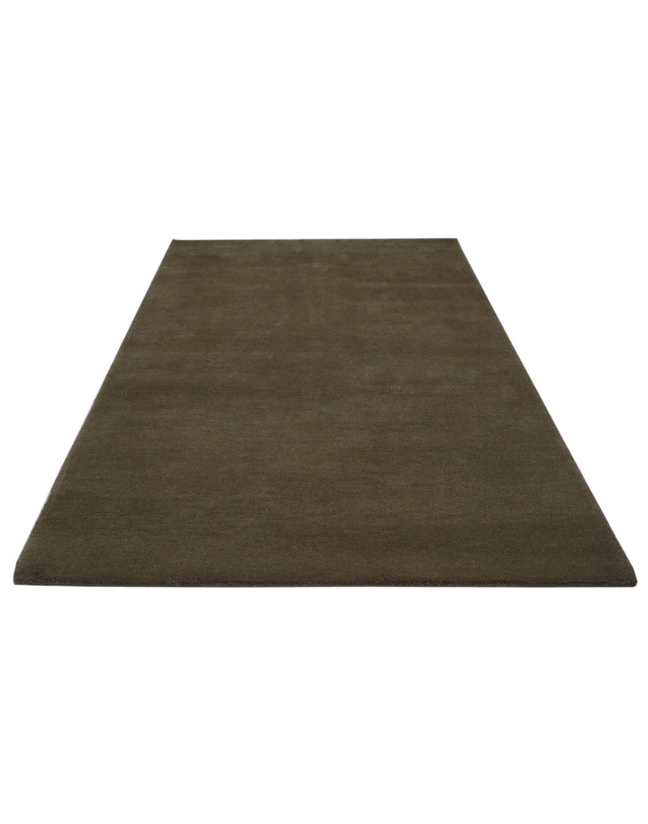 I C O N - T R U F F L E rug in a classic dark brown color, made from 100% New Zealand wool with dense tufting.