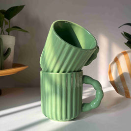 Kiwi Mug featuring a glossy green glaze and textured ceramic body