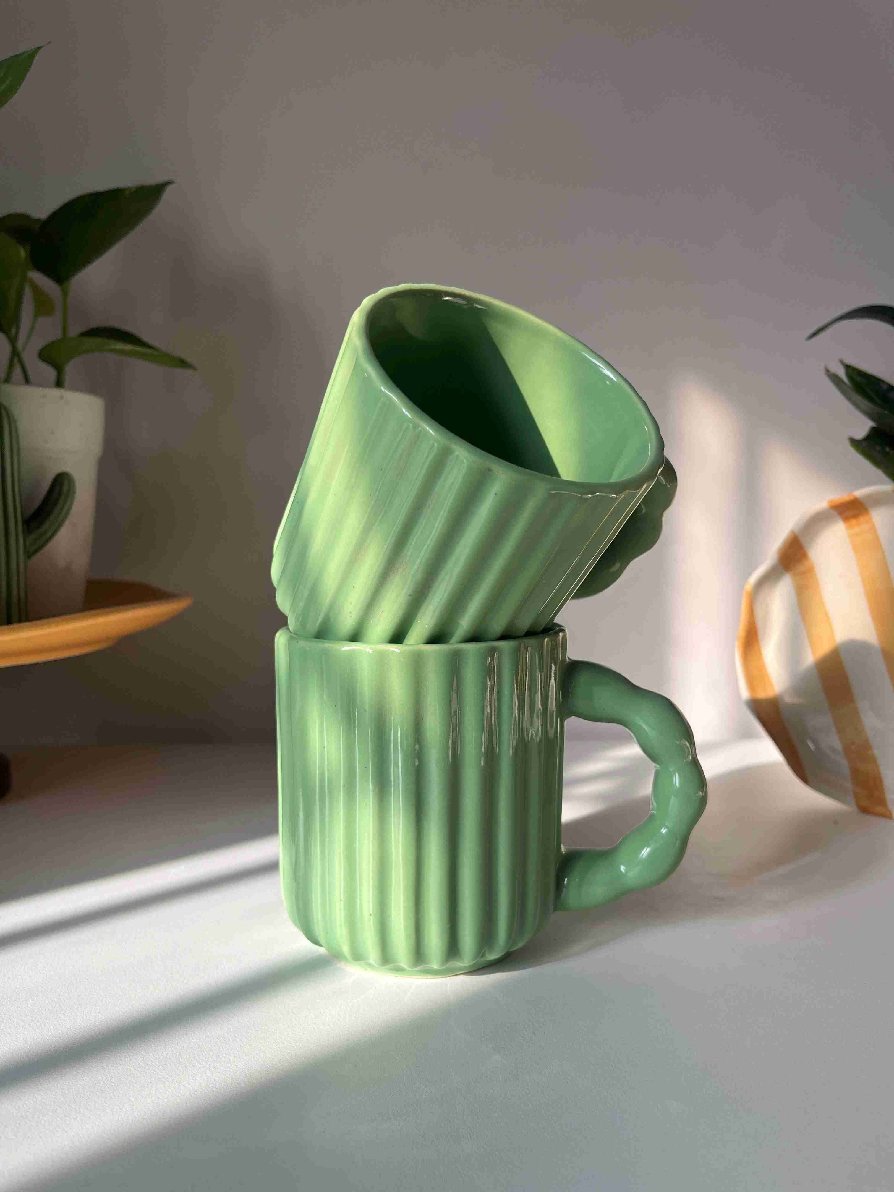Kiwi Mug featuring a glossy green glaze and textured ceramic body