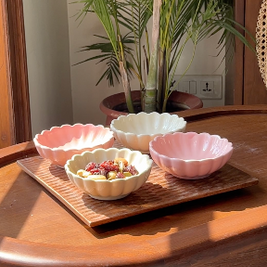 Loom & Bloom serving set featuring a scalloped wooden tray and four ceramic flower bowls.