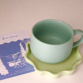 Modern ceramic tea cup in calming green hue