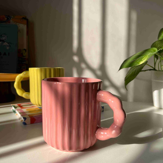 Modern ceramic mug with decorative beaded handle