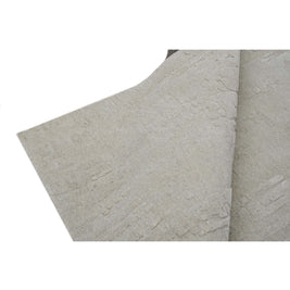S C U L P T E D - U R B A N A luxury modern rug by Cherom in soft grey with carved texture.