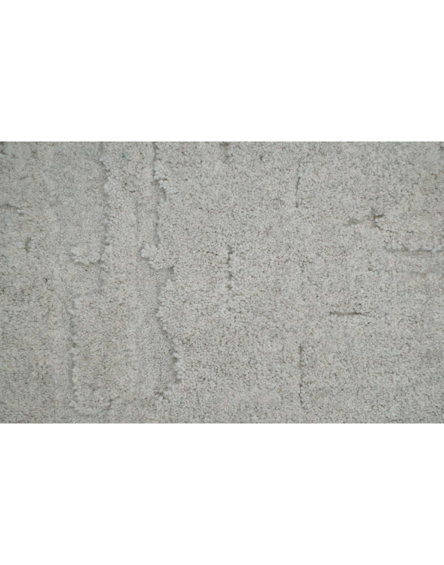 S C U L P T E D - U R B A N A luxury modern rug by Cherom featuring a soft grey tone and textured design.