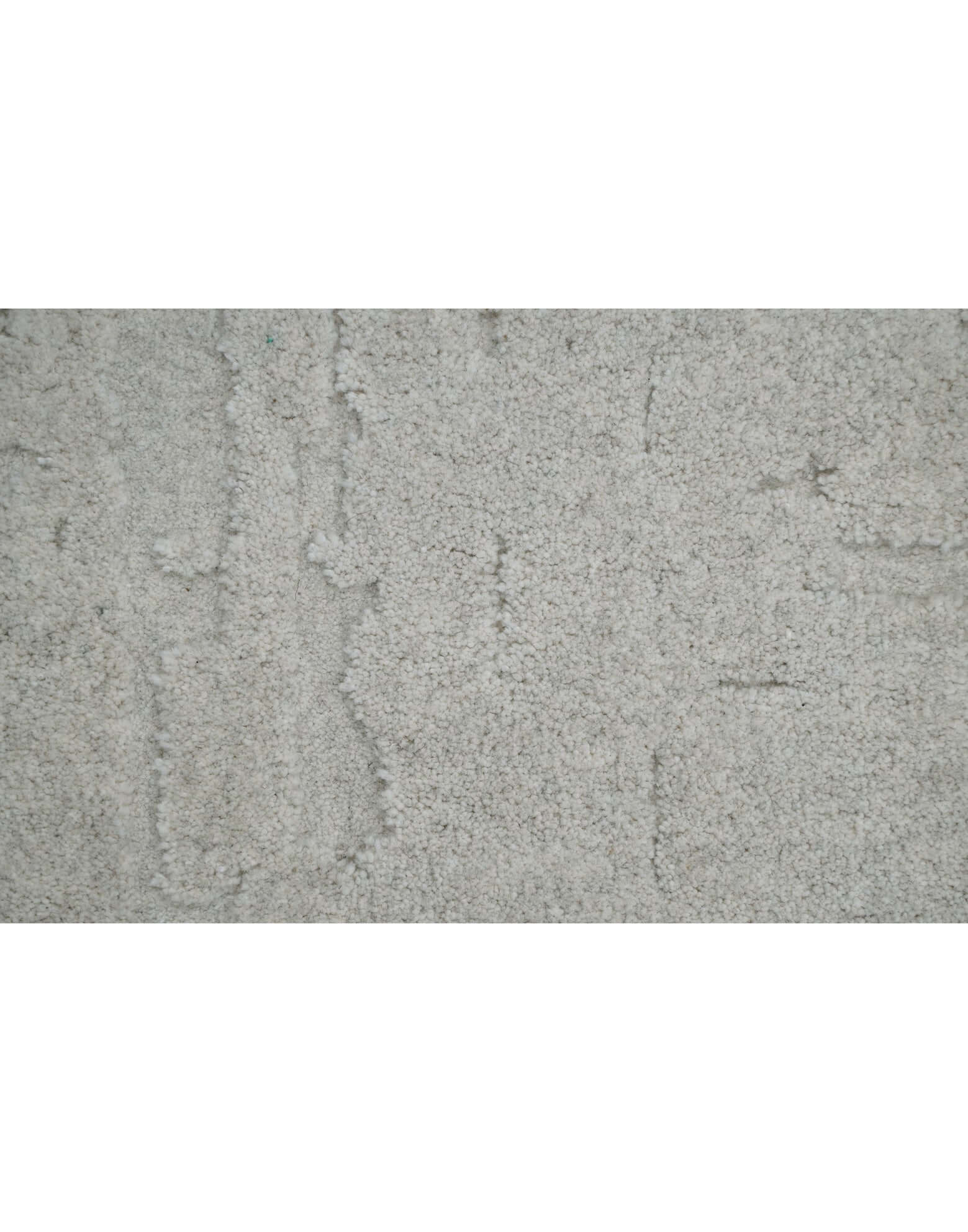 S C U L P T E D - U R B A N A luxury modern rug by Cherom featuring a soft grey tone and textured design.