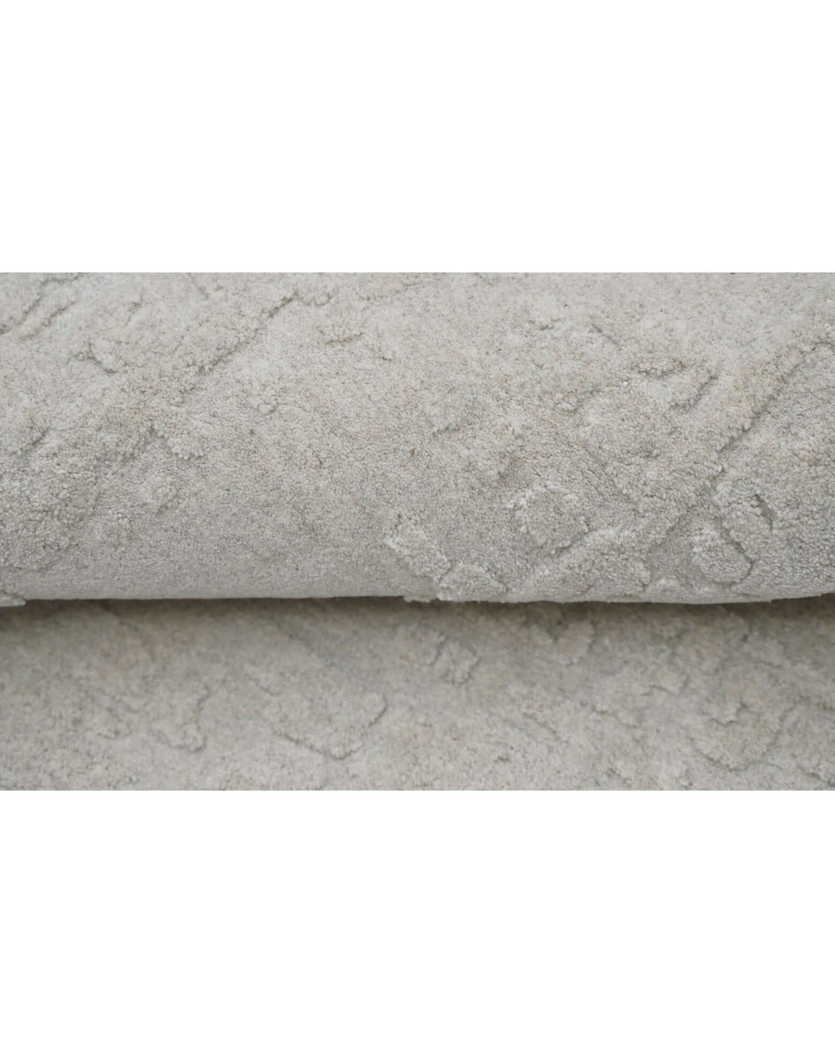 S C U L P T E D - U R B A N A luxury modern rug by Cherom - soft grey with textured detail, ideal for contemporary interiors.