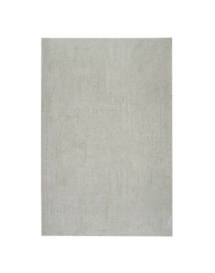 S C U L P T E D - U R B A N A luxury modern rug by Cherom in soft grey tone with carved texture.