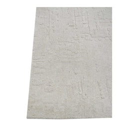 S C U L P T E D - U R B A N A luxury modern rug by Cherom, featuring a soft grey tone and carved texture.