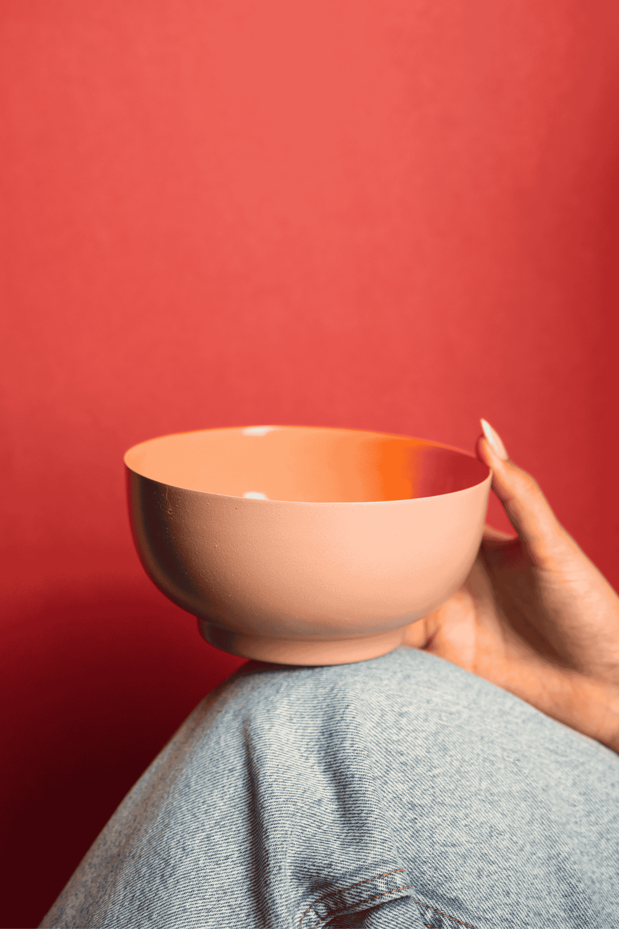 Contemporary Bon Bon metal bowl with textured exterior and glossy interior
