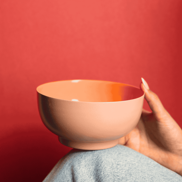 Contemporary Bon Bon metal bowl with textured exterior and glossy interior