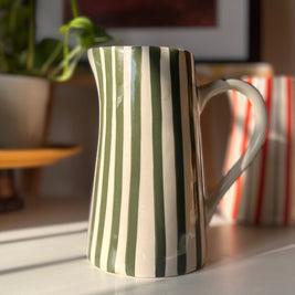 Glossy green striped ceramic vase for flowers and foliage