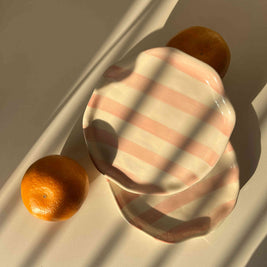 Pink Taffy ceramic plate with hand-painted blush stripes and glossy finish