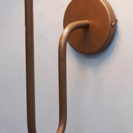 Elegant wall lamp design with a black shade and a unique copper metal arm, perfect for modern interiors